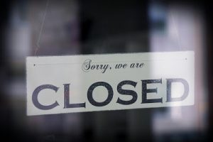 Closed Sign In Store Window